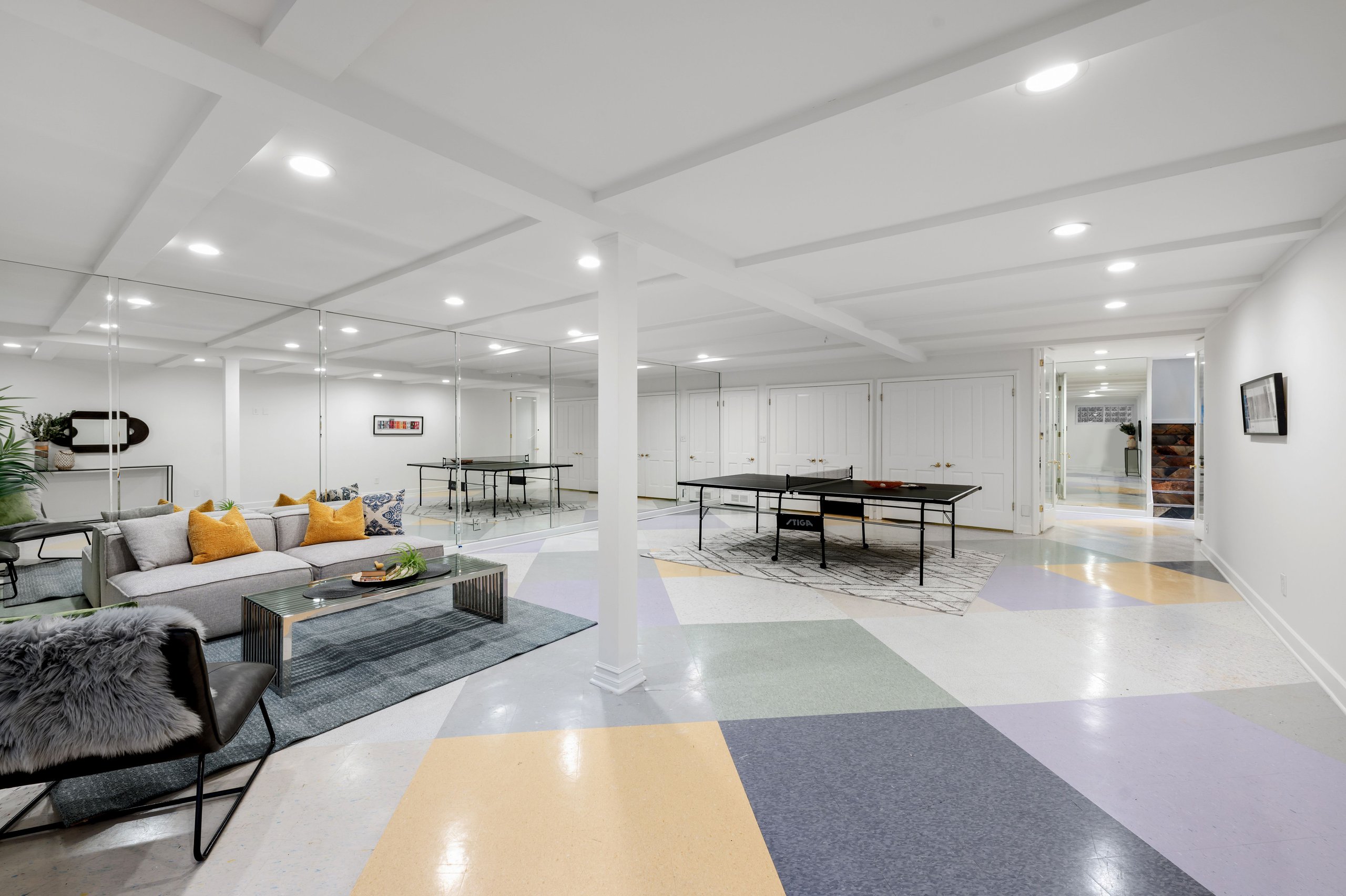 Modern finished basement with ping pong table